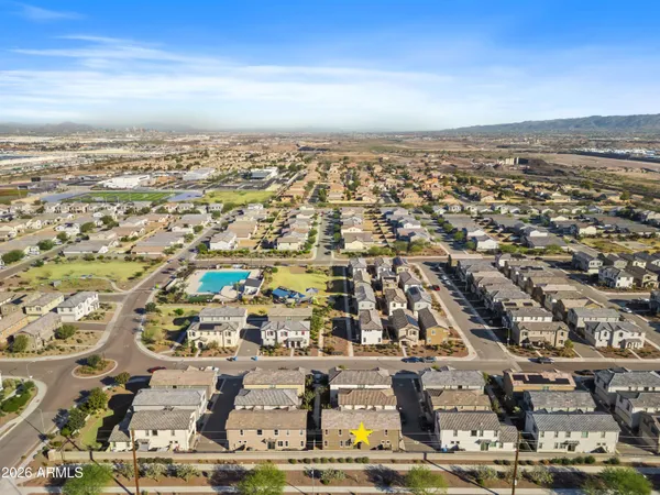 an aerial view of a city with ocean view