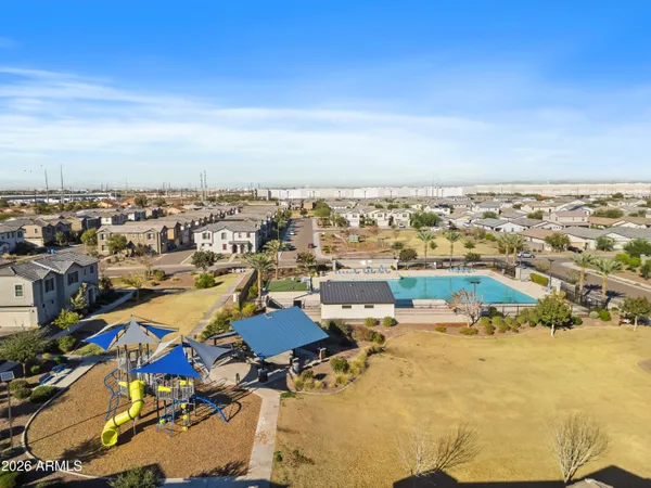 an aerial view of residential building and car parked on street side