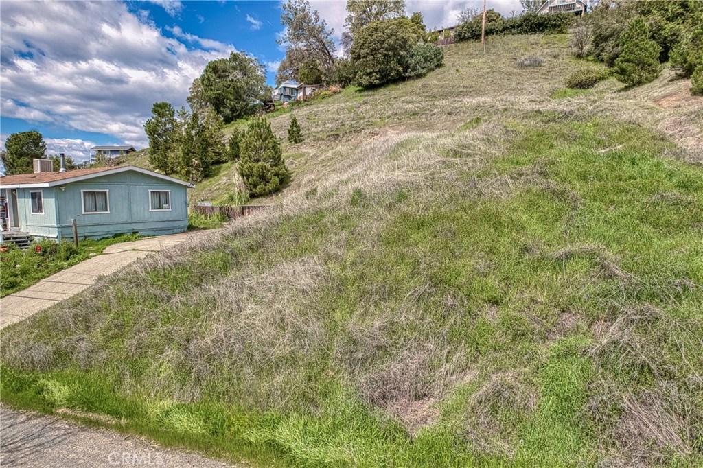 7037 Butte Street Nice, CA 95464 - Photo 15 of 16 a view of a house with a yard