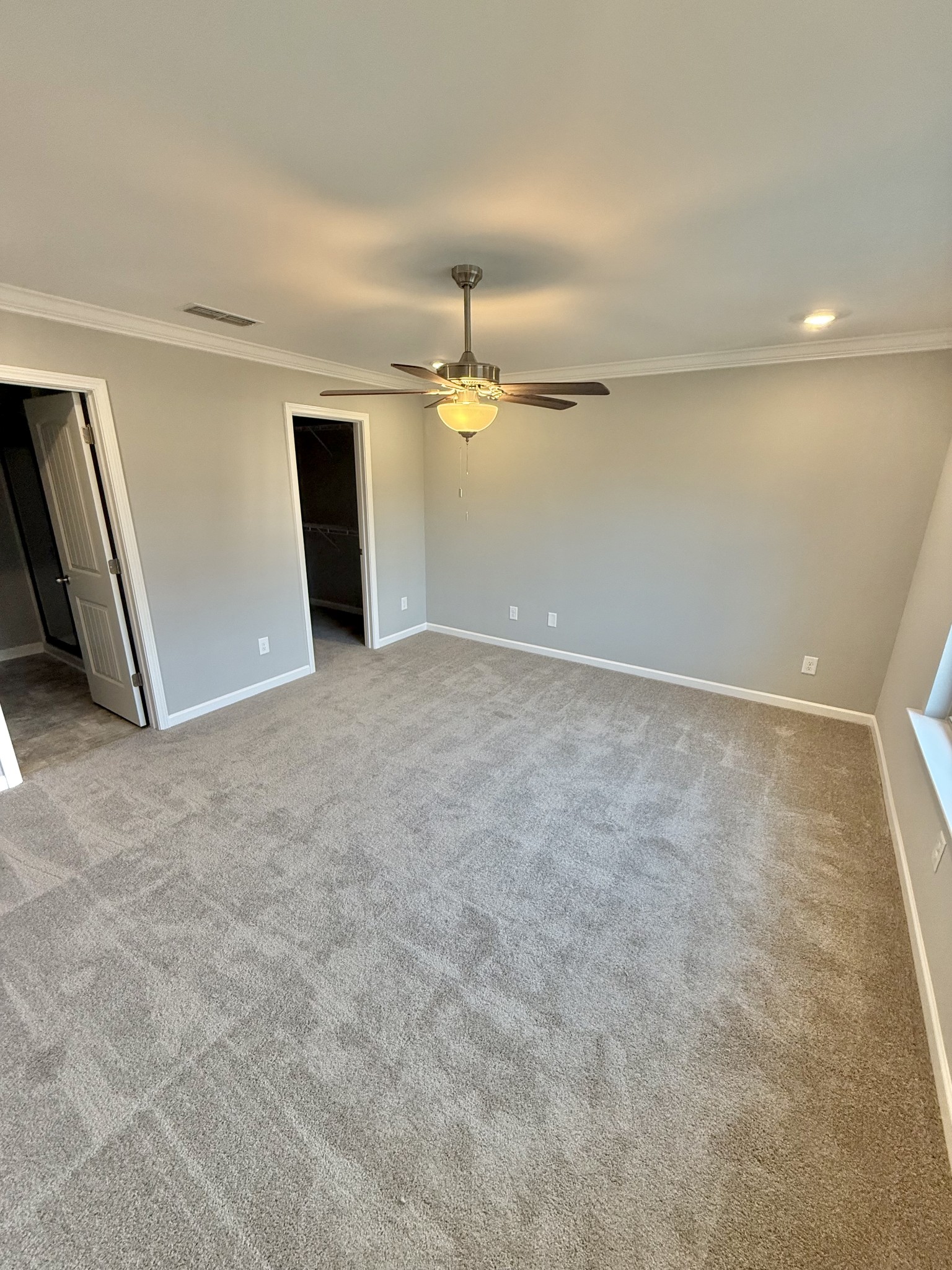 20 Stonehenge Lane Manchester, TN 37355 - Photo 5 of 11 an empty room with chandelier fan and windows