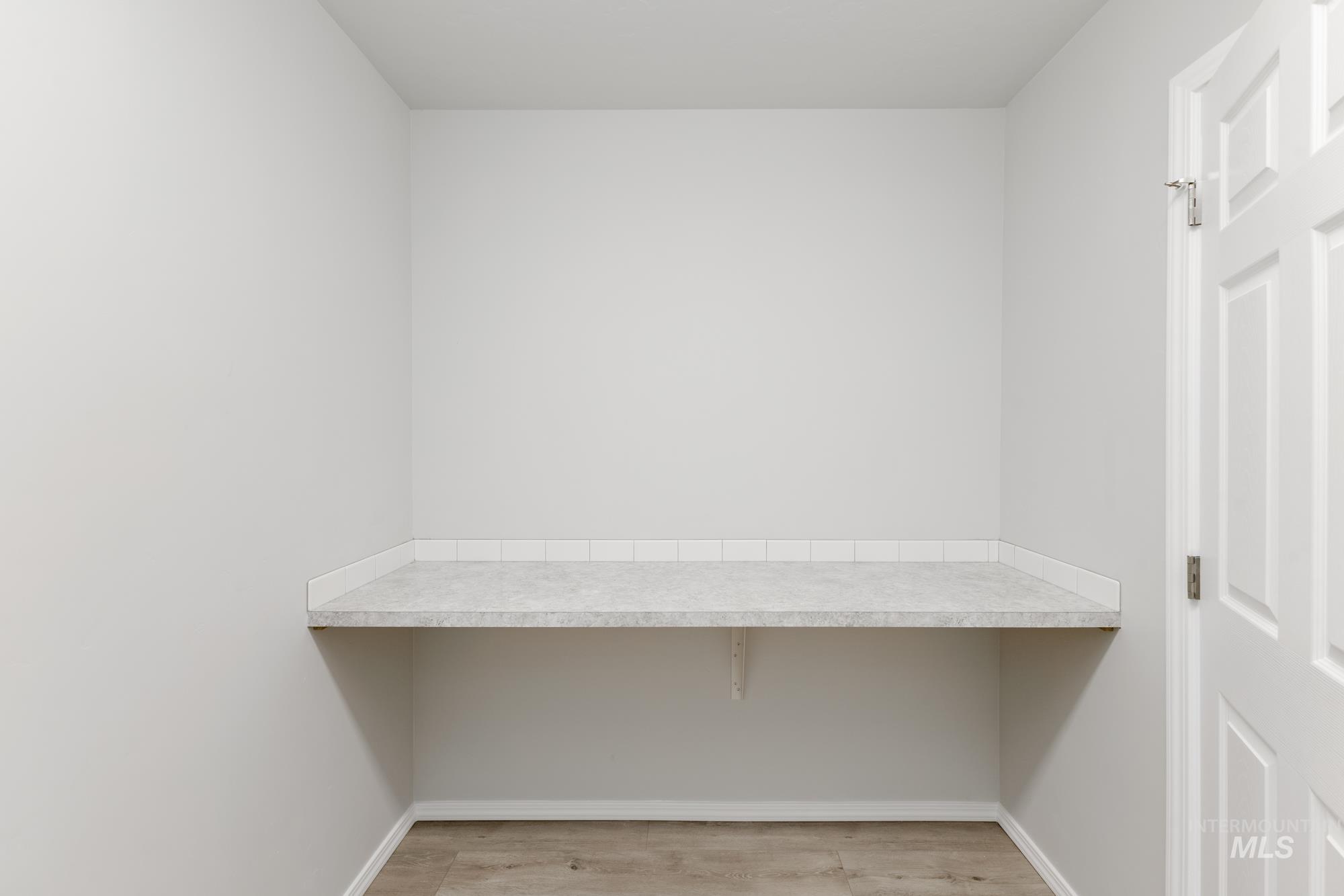 12842 Ropers Street Nampa, ID 83651 - Photo 22 of 29 Built-in countertop with a subtle speckled finish, complete with a tiled backsplash