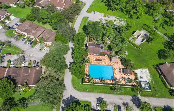 an aerial view of a house with a garden