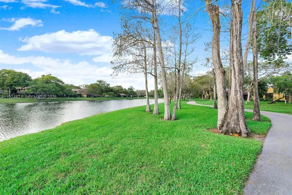 a view of a lake with a yard