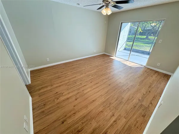 a view of an empty room with a window