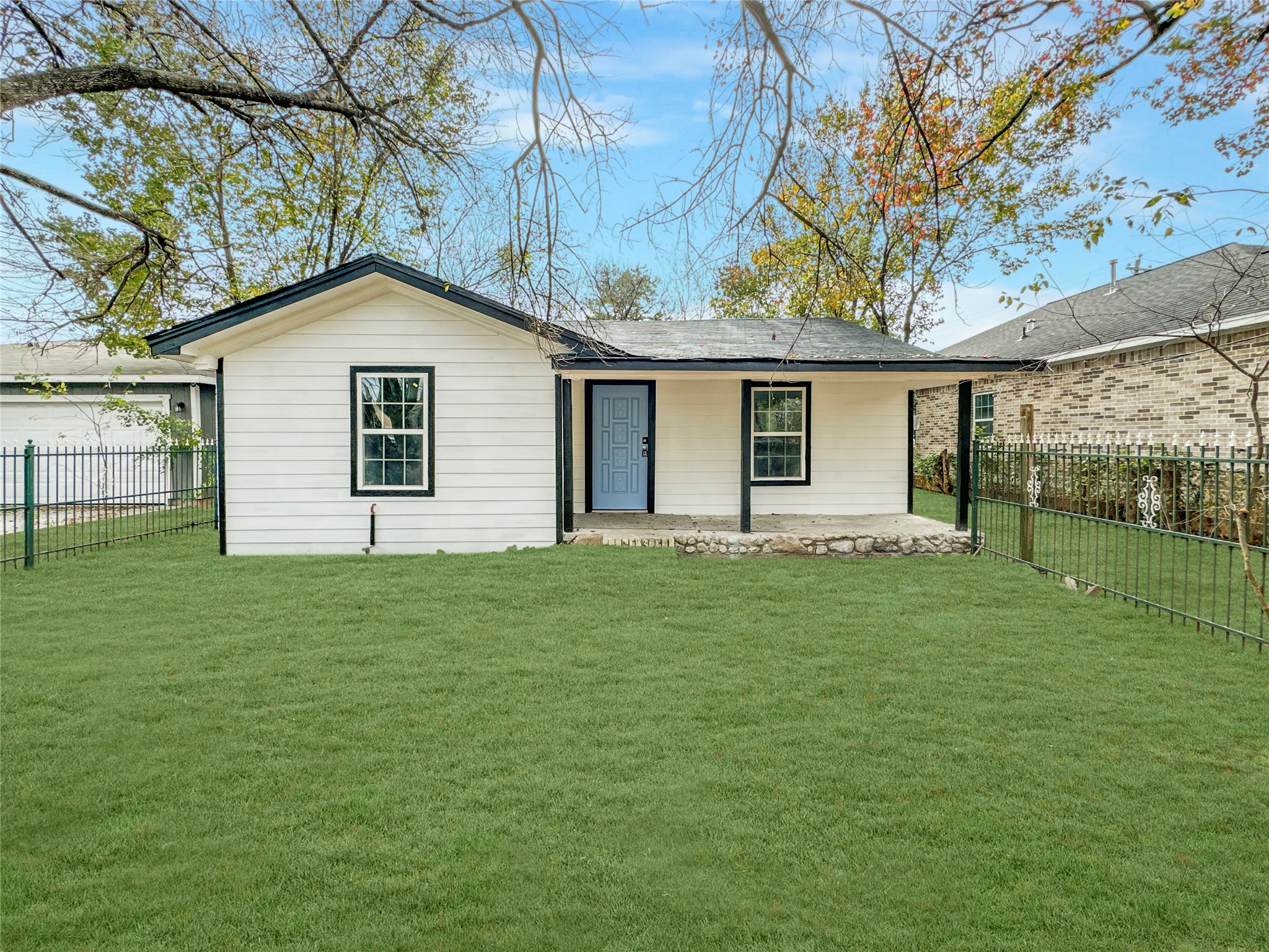 a backyard of a house with lots of green space