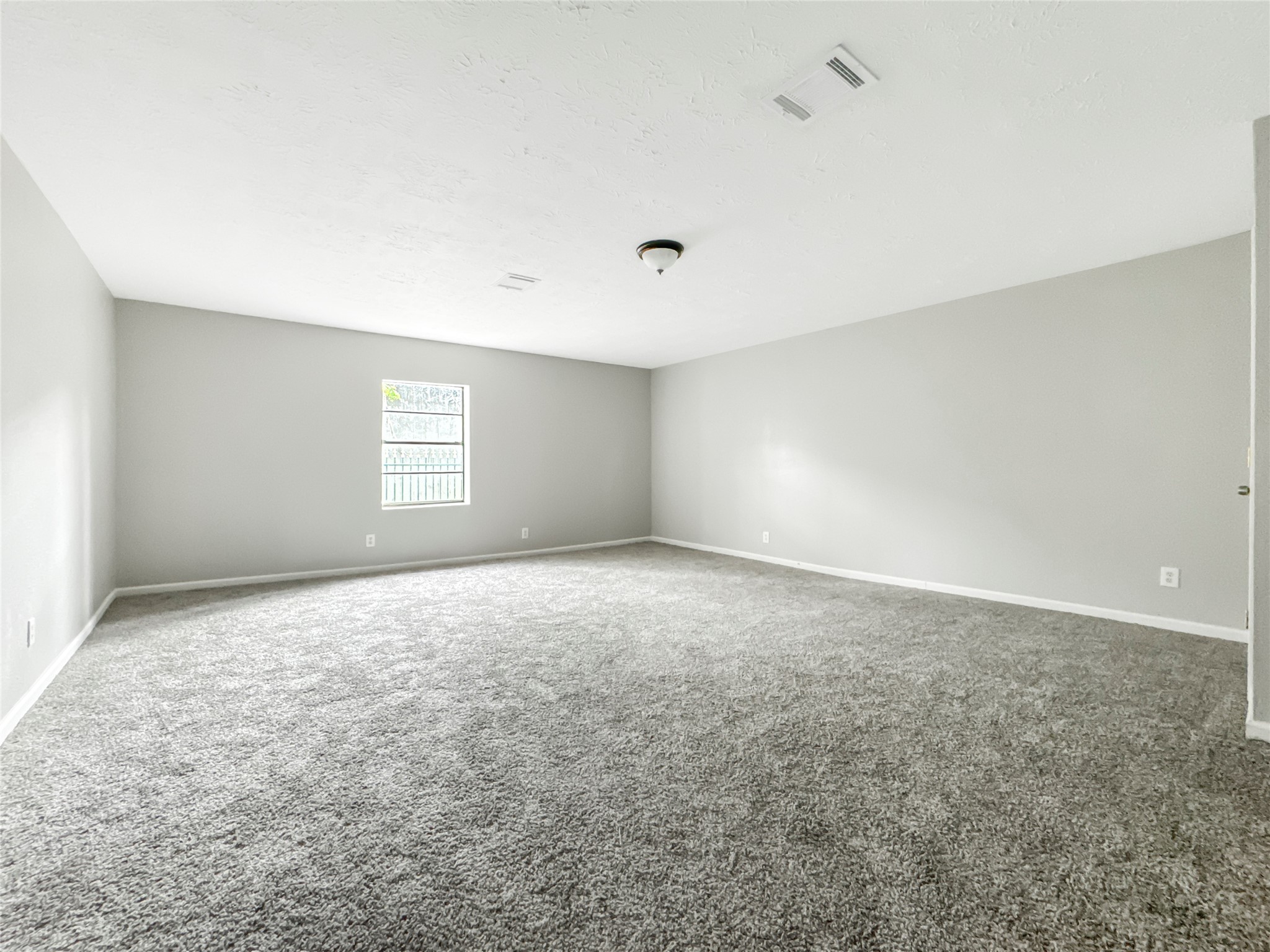 306 Armstrong Street Houston, TX 77029 - Photo 14 of 30 a view of an empty room with a window