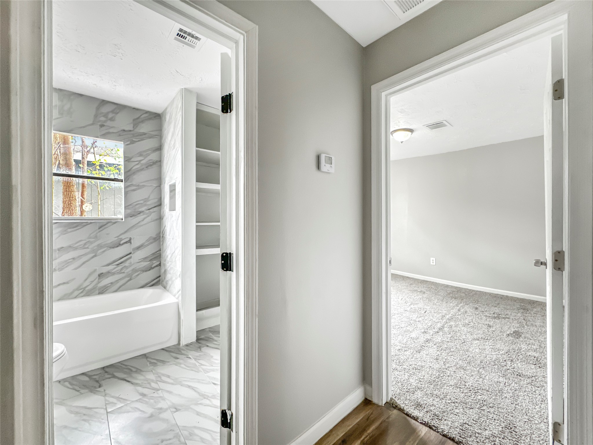 306 Armstrong Street Houston, TX 77029 - Photo 21 of 30 a view of a bathroom with a glass door