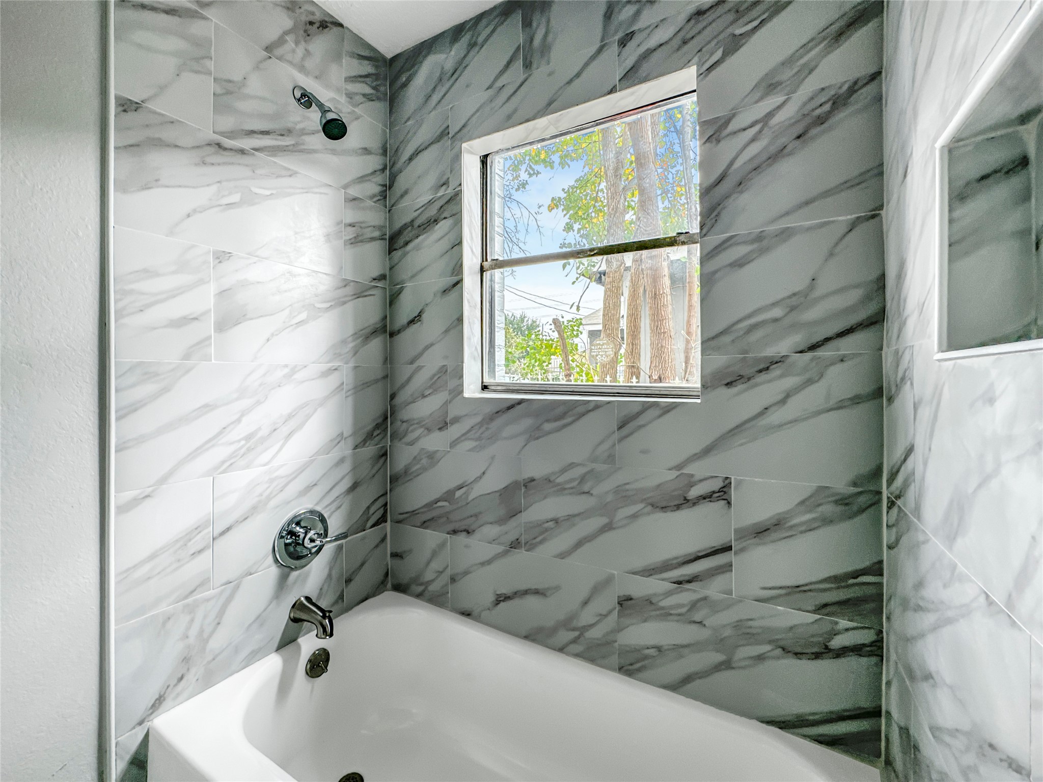306 Armstrong Street Houston, TX 77029 - Photo 22 of 30 a bathroom with a sink and a shower