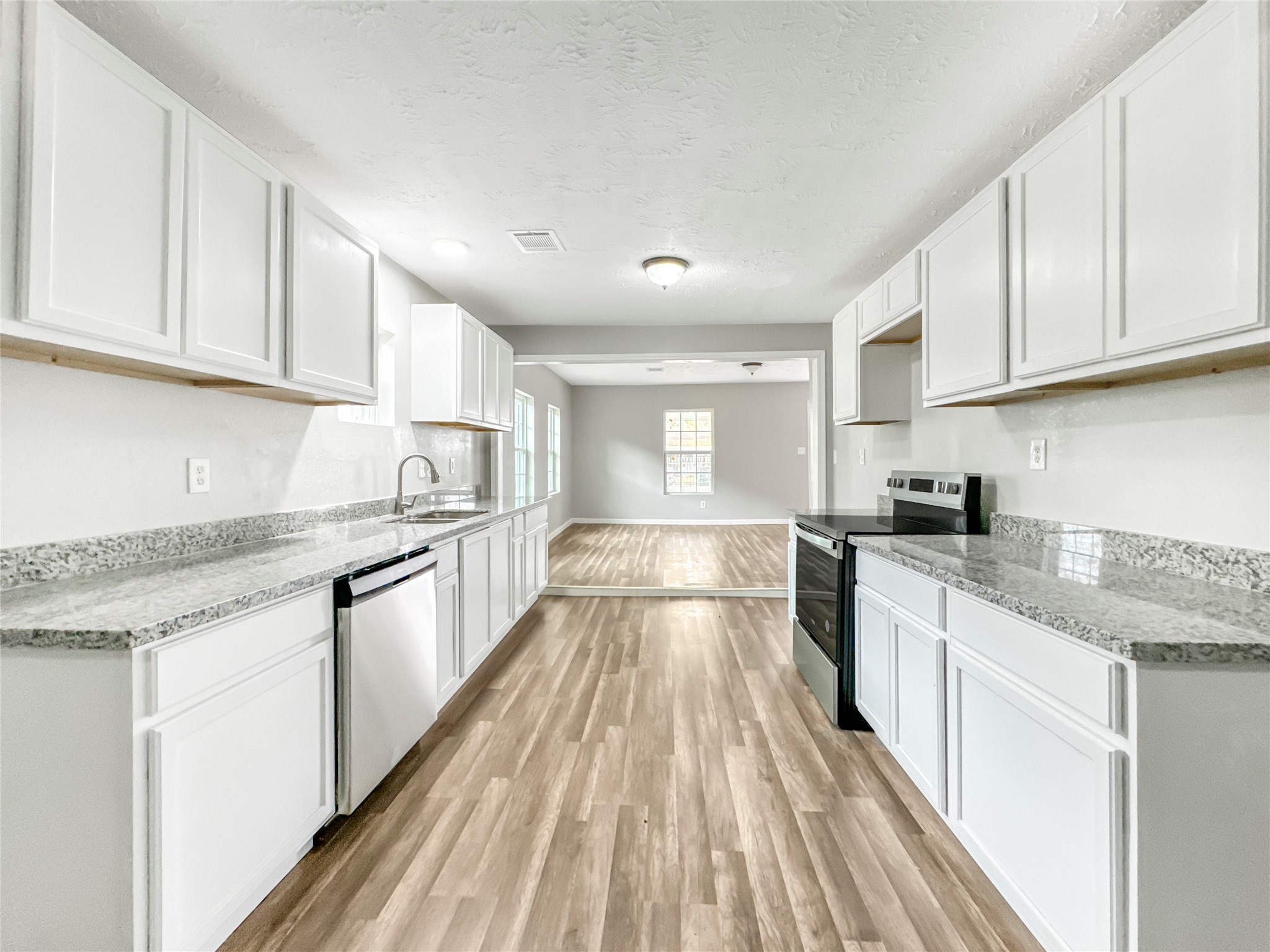 306 Armstrong Street Houston, TX 77029 - Photo 7 of 30 a large kitchen with cabinets