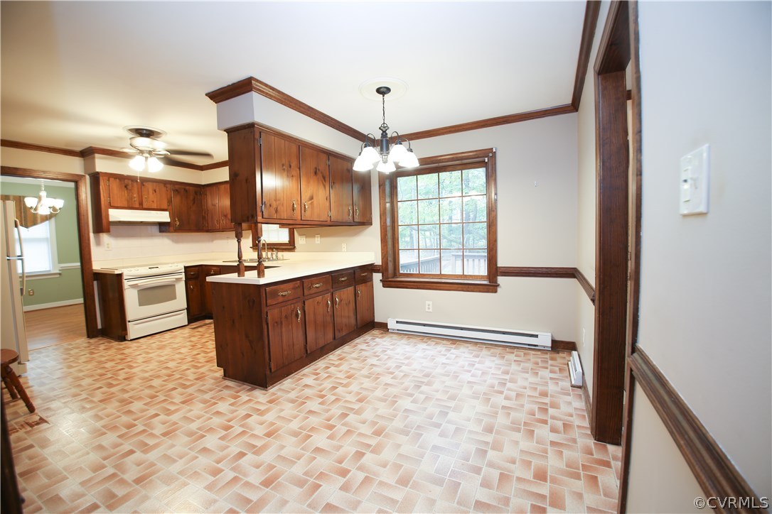 4524 Fordham Road North Chesterfield, VA 23236 - Photo 10 of 30 a view of a kitchen with kitchen island a counter top space a sink cabinets and stainless steel appliances