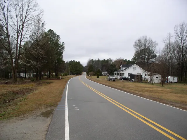 a view of a town with barn house