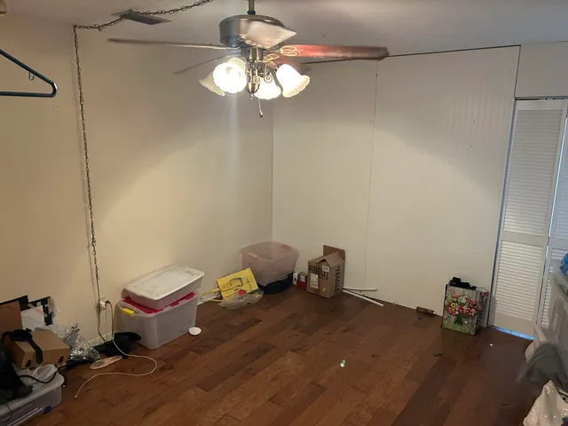 a room with a table and a chandelier