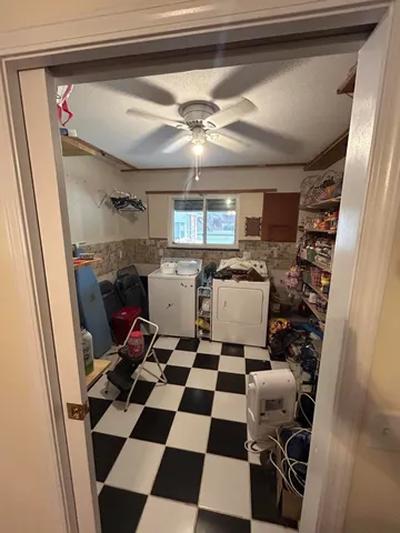 a kitchen with a sink and a refrigerator