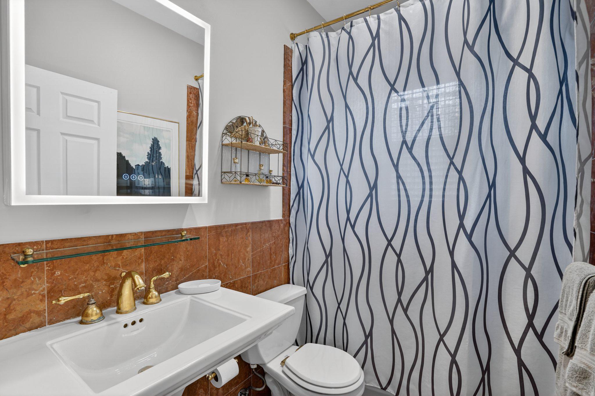 1233 E Street Southeast Washington, DC 20003 - Photo 19 of 37 Elegant bathroom with modern accents.