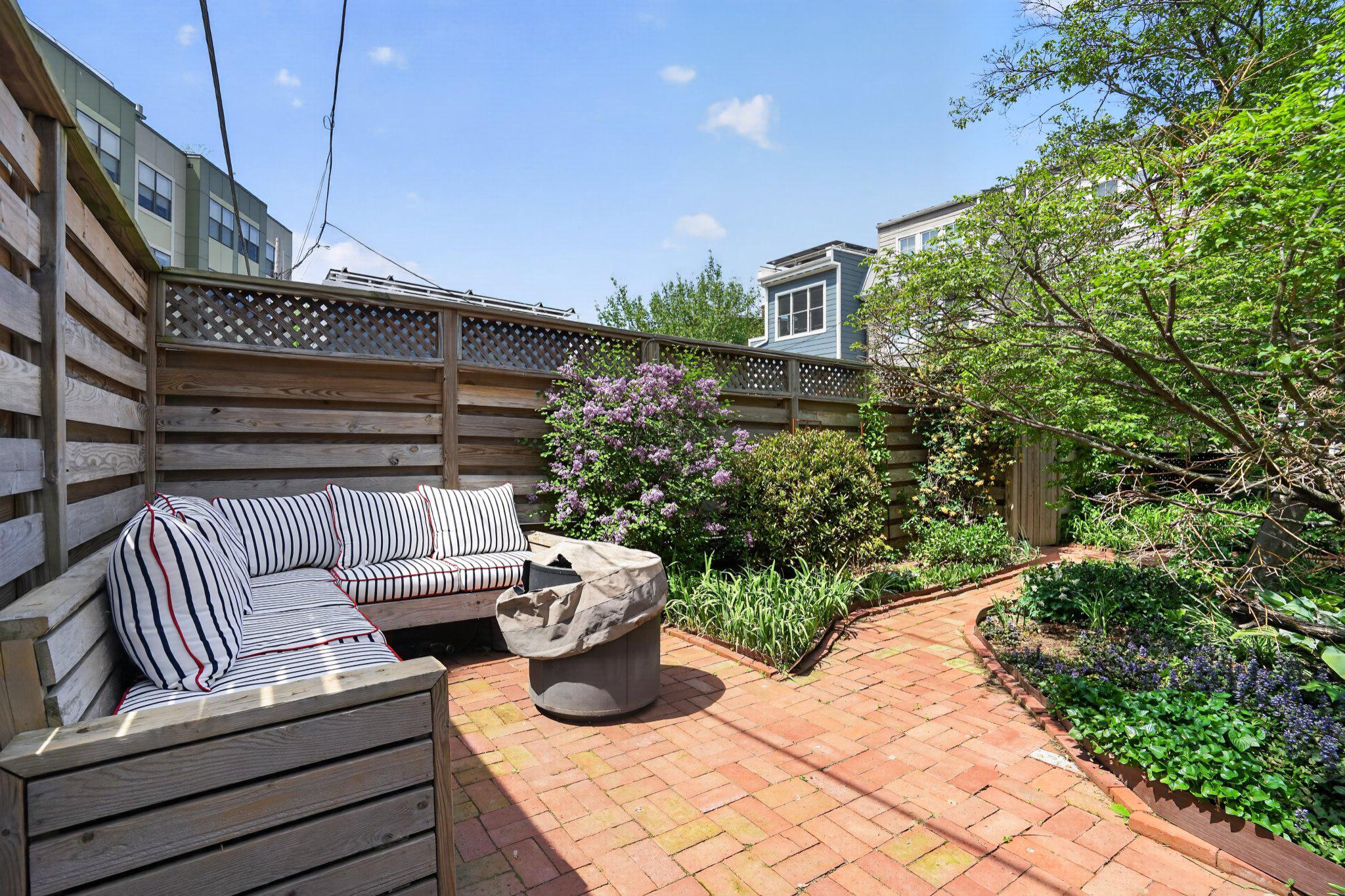 1233 E Street Southeast Washington, DC 20003 - Photo 29 of 37 Charming garden retreat with lush blooms.