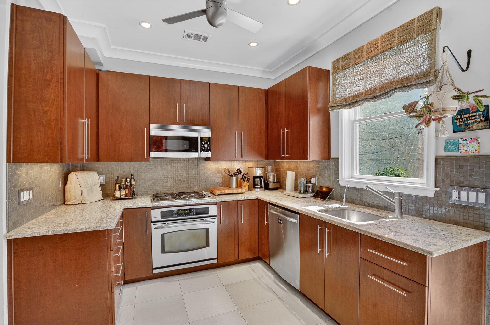1233 E Street Southeast Washington, DC 20003 - Photo 9 of 37 Modern kitchen with warm wood tones.