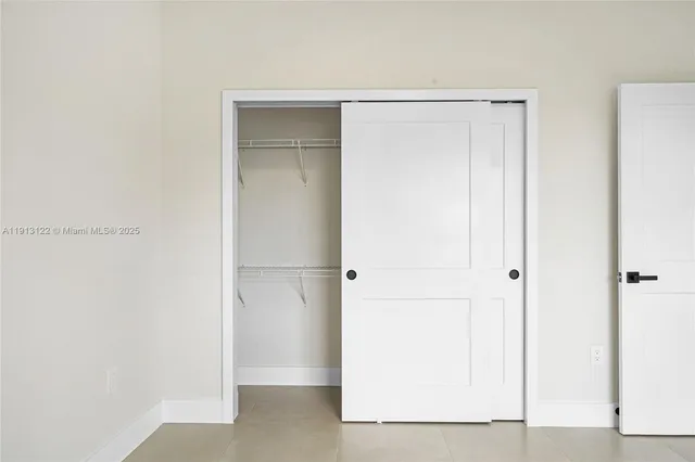 a bath tub sitting next to a white toilet