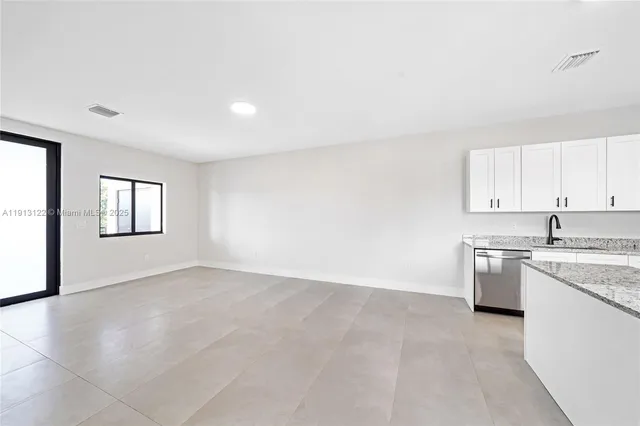a view of a kitchen with a sink