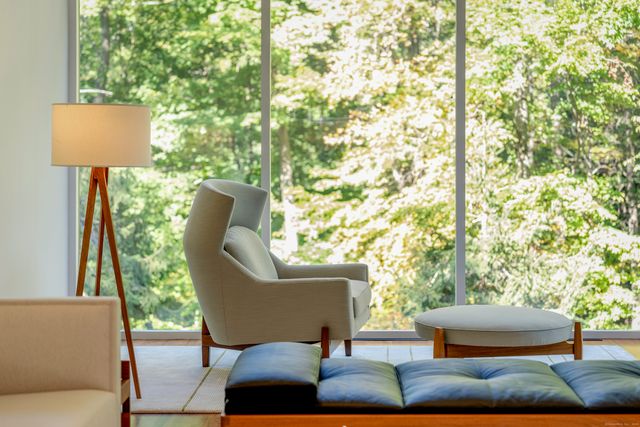 a outdoor living space with furniture and a lamp