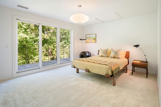 a bedroom with a bed and a couch