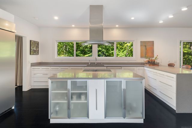 a view of kitchen with windows and furniture