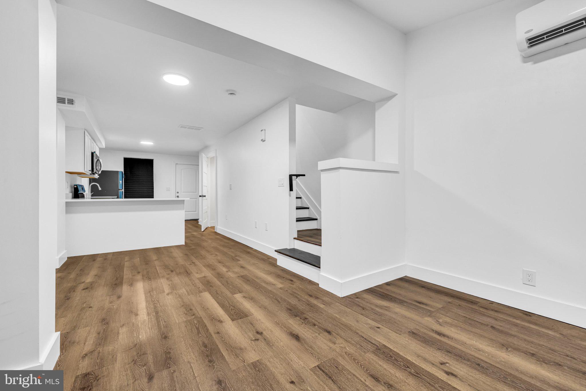 2801 Round Road Baltimore, MD 21225 - Photo 3 of 29 a view of a kitchen with wooden floor and a sink