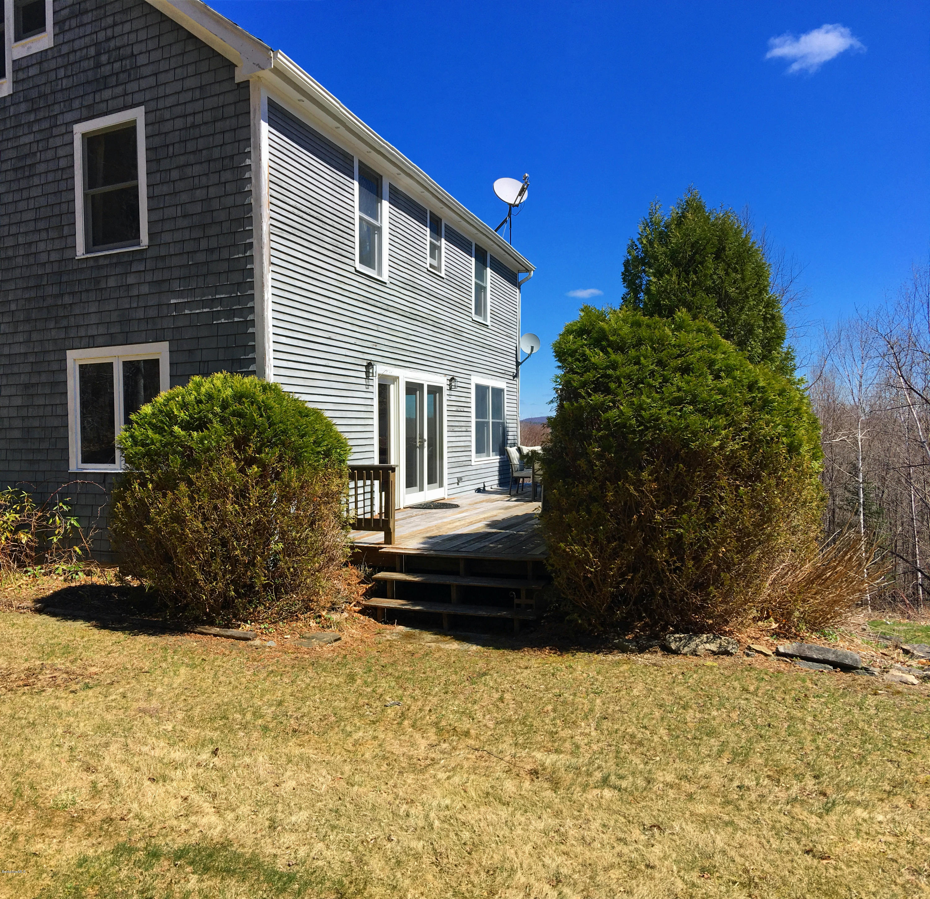 171 Schultz Road Washington, MA 01223 - Photo 23 of 27 a front view of a house with a yard