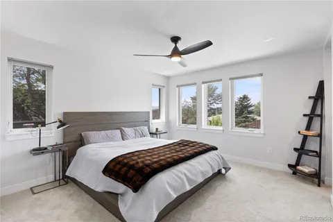 a bedroom with a bed and a television