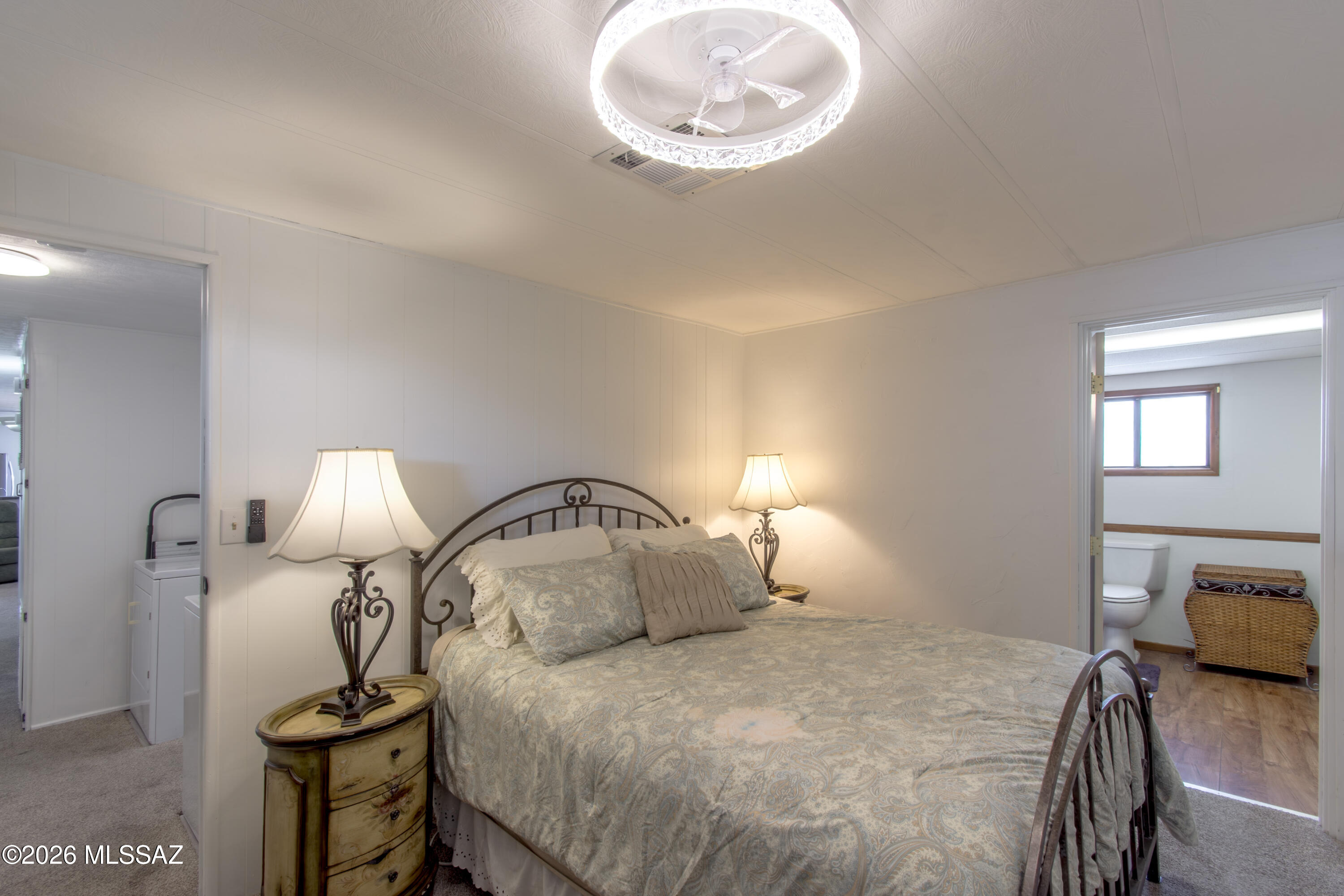 4550 North Flowing Wells Road, Unit 155 Tucson, AZ 85705 - Photo 17 of 40 a bedroom with a bed and window