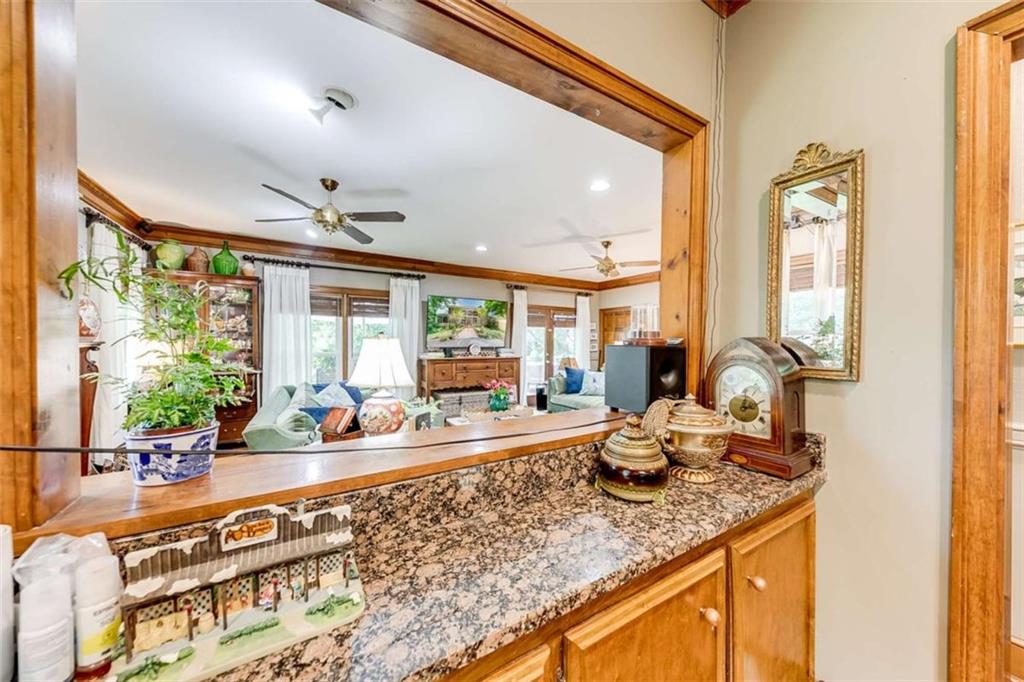 6180 Old Jefferson Road Athens, GA 30607 - Photo 35 of 95 a kitchen with granite countertop a sink and a counter top space