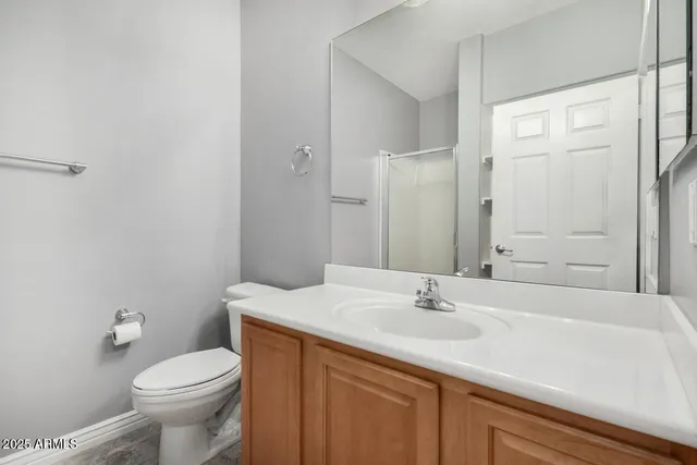 a bathroom with a sink toilet and vanity