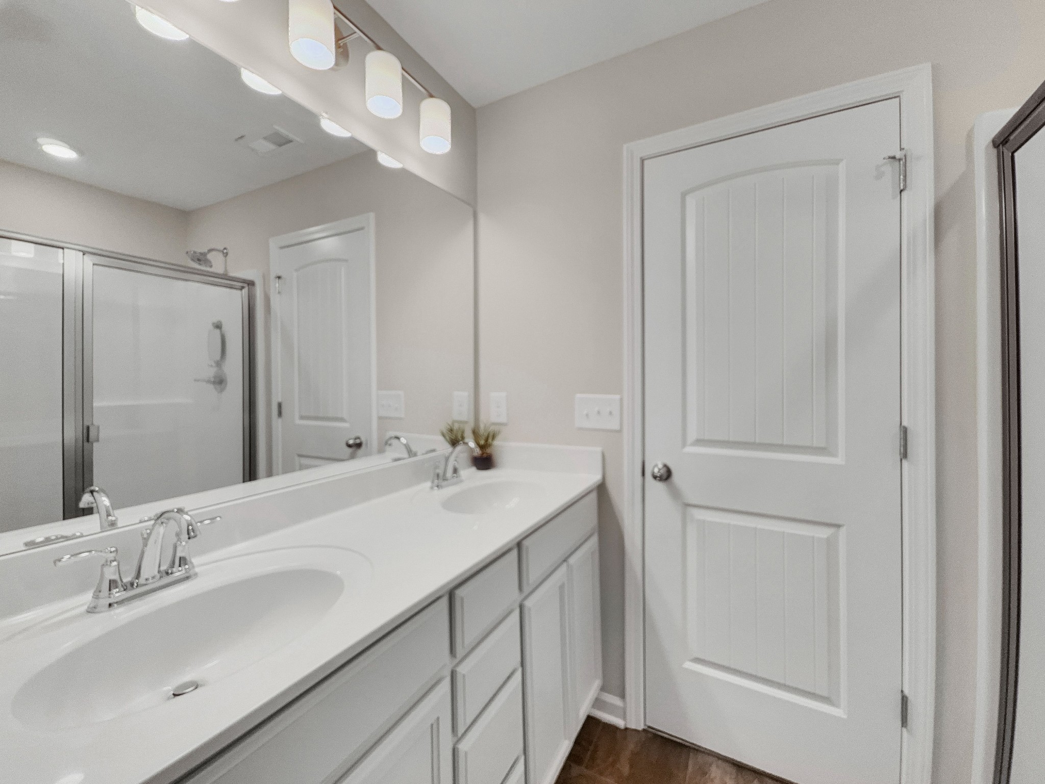 147 Addi Street Pleasant View, TN 37146 - Photo 17 of 27 a bathroom with double vanity sink and a mirror