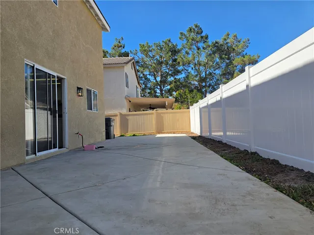 a view of a house with a yard and a garage