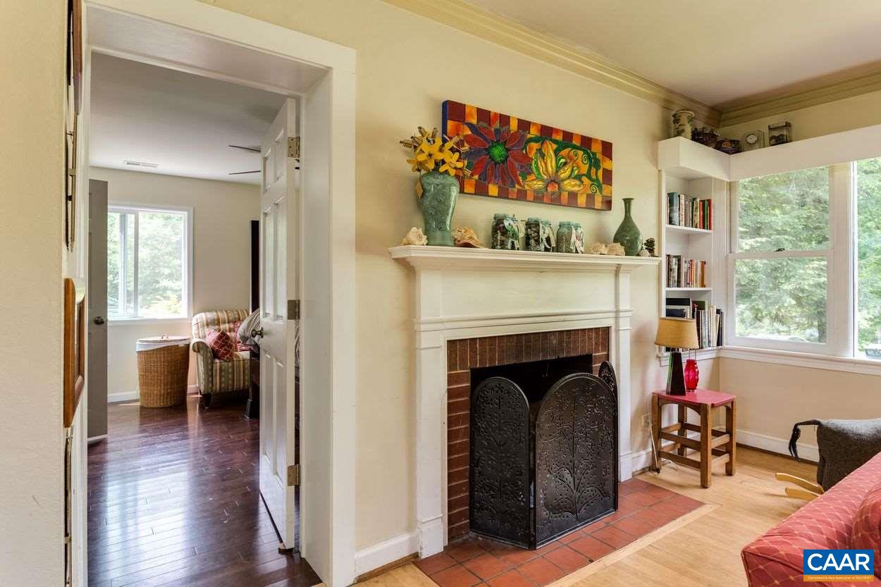 1612 Keith Valley Road Charlottesville, VA 22901 - Photo 5 of 30 a view of a livingroom with furniture and a fireplace