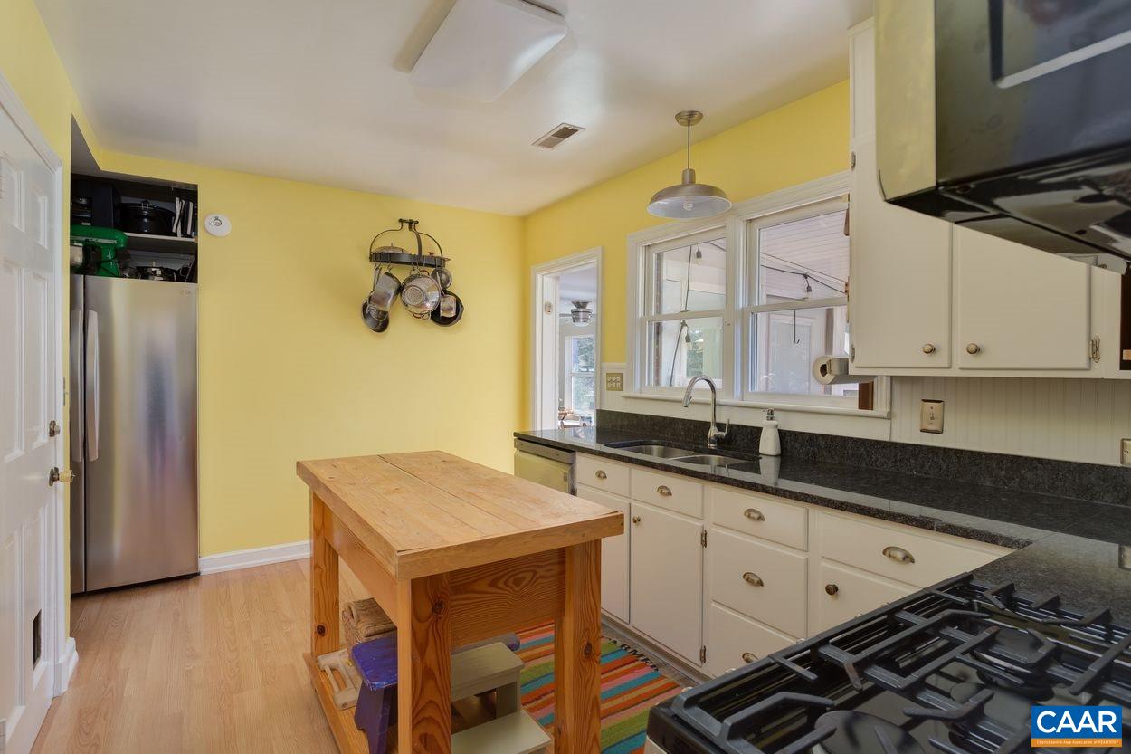 1612 Keith Valley Road Charlottesville, VA 22901 - Photo 7 of 30 a kitchen with granite countertop a sink stove and refrigerator