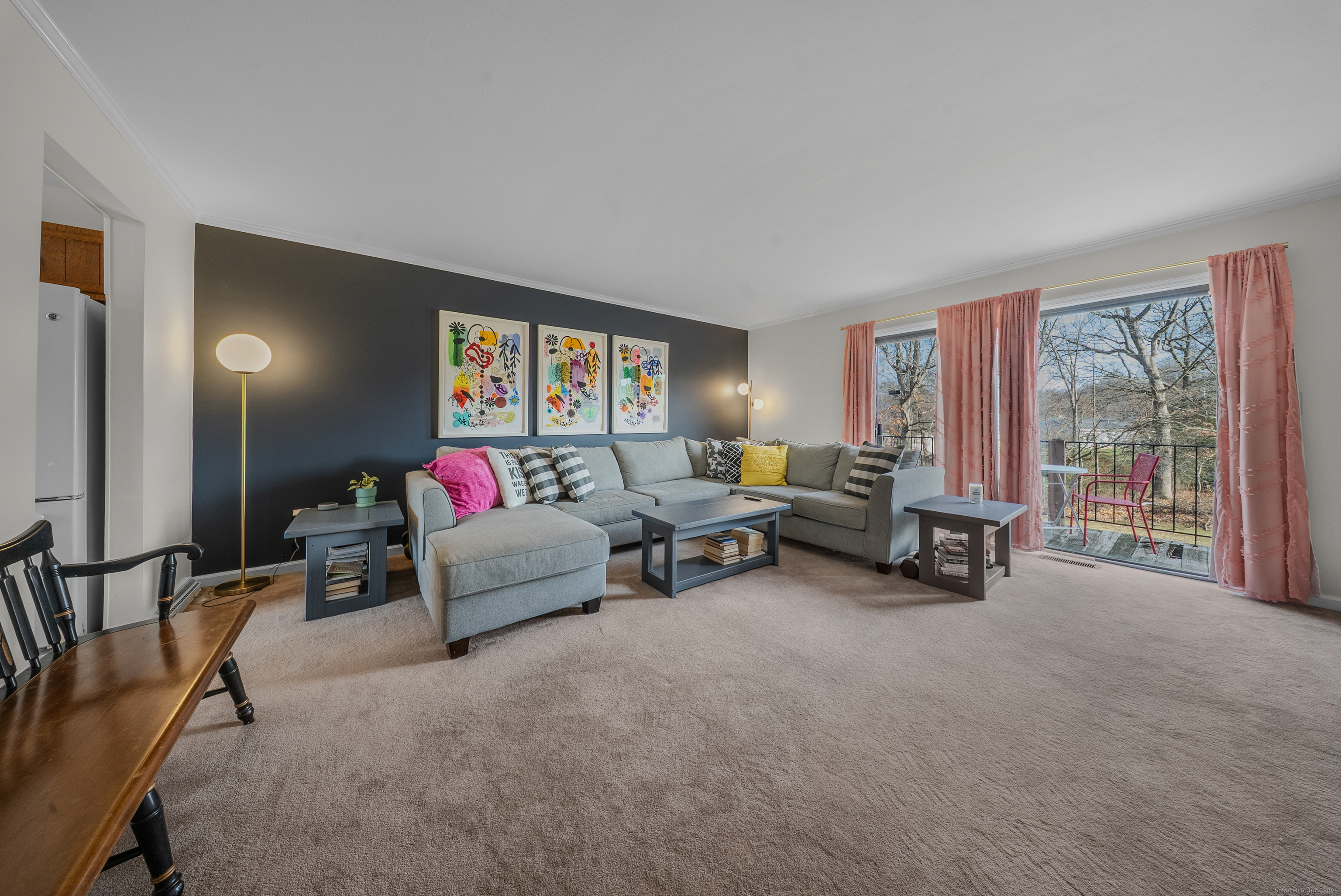 83 Carriage Drive, Unit 83 Milford, CT 06460 - Photo 11 of 33 a living room with furniture and a flat screen tv