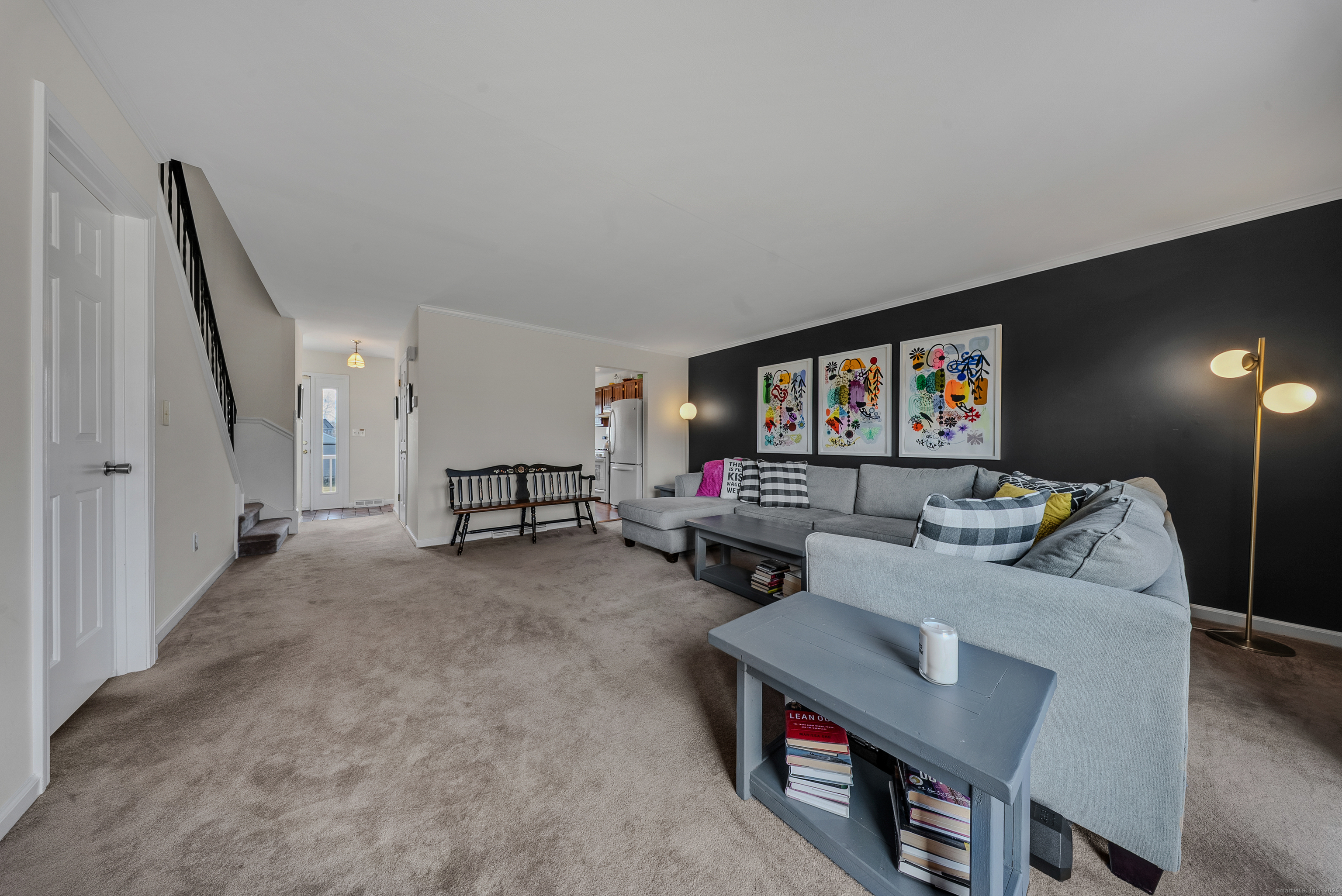 83 Carriage Drive, Unit 83 Milford, CT 06460 - Photo 13 of 33 a living room with furniture and a flat screen tv