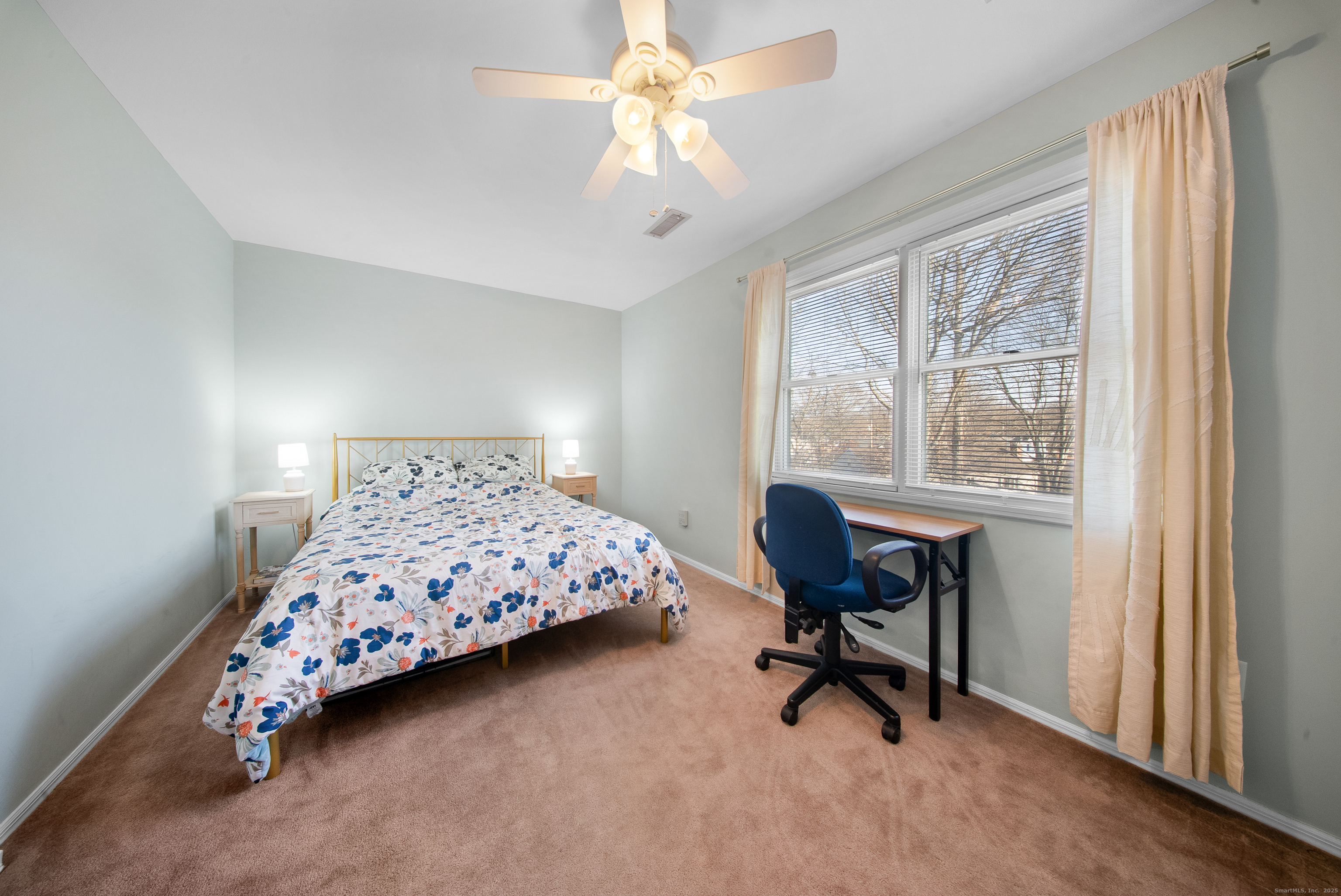 83 Carriage Drive, Unit 83 Milford, CT 06460 - Photo 23 of 33 a bedroom with a bed chair and a window