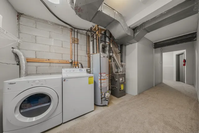 a view of a storage & utility room with washer and dryer