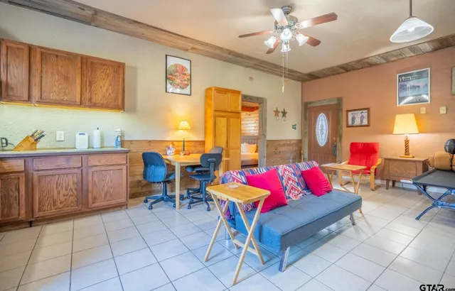 a kitchen with a cabinets and window