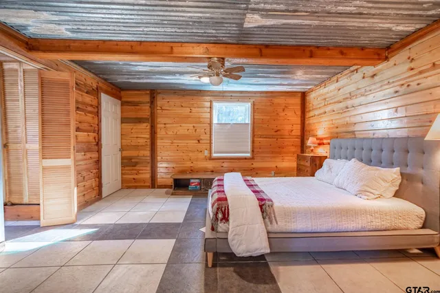 a bathroom with a toilet a sink and a mirror