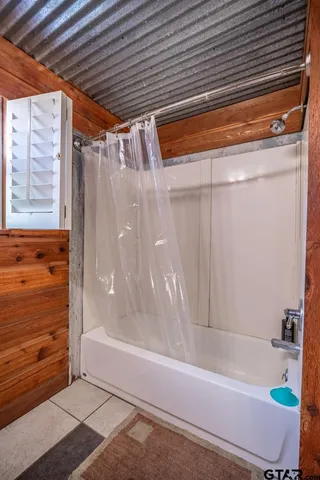 a view of backyard with small cabin