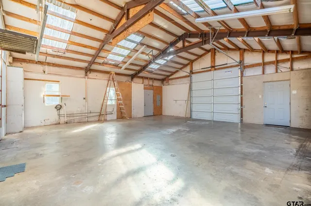 a view of a room with wooden walls