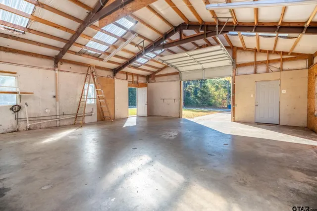 a view of a forest with mountains in the background