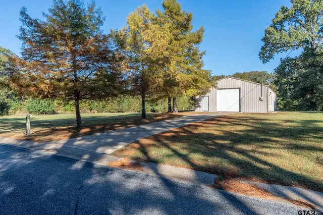 a view of a backyard of the house