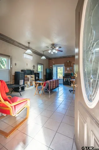 a living room with a couch and a chandelier