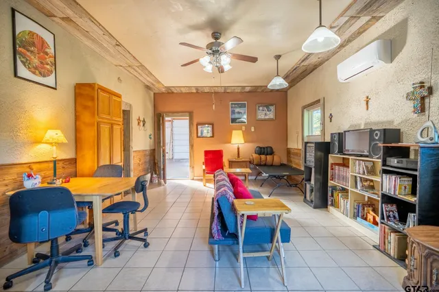 a bed room with furniture and a chandelier