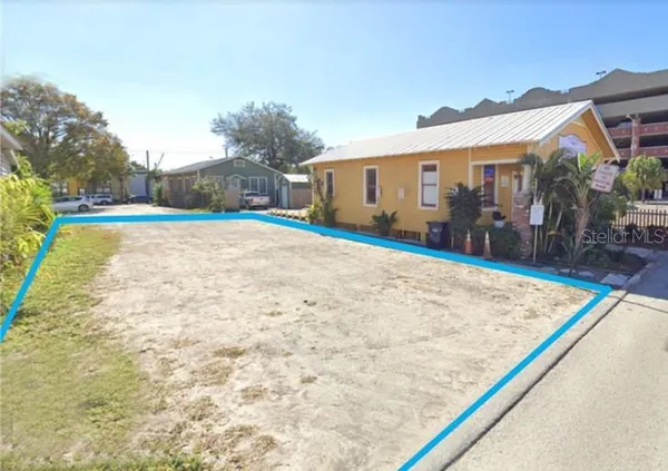 a view of a house with basketball court
