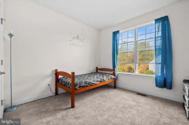 a bedroom with a bed and a cabinets