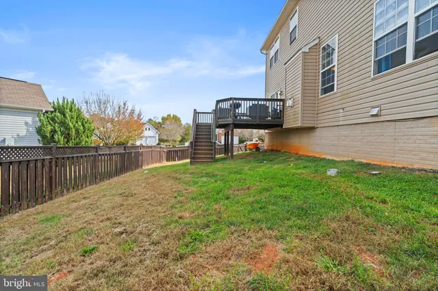 a view of a house with backyard porch and sitting area